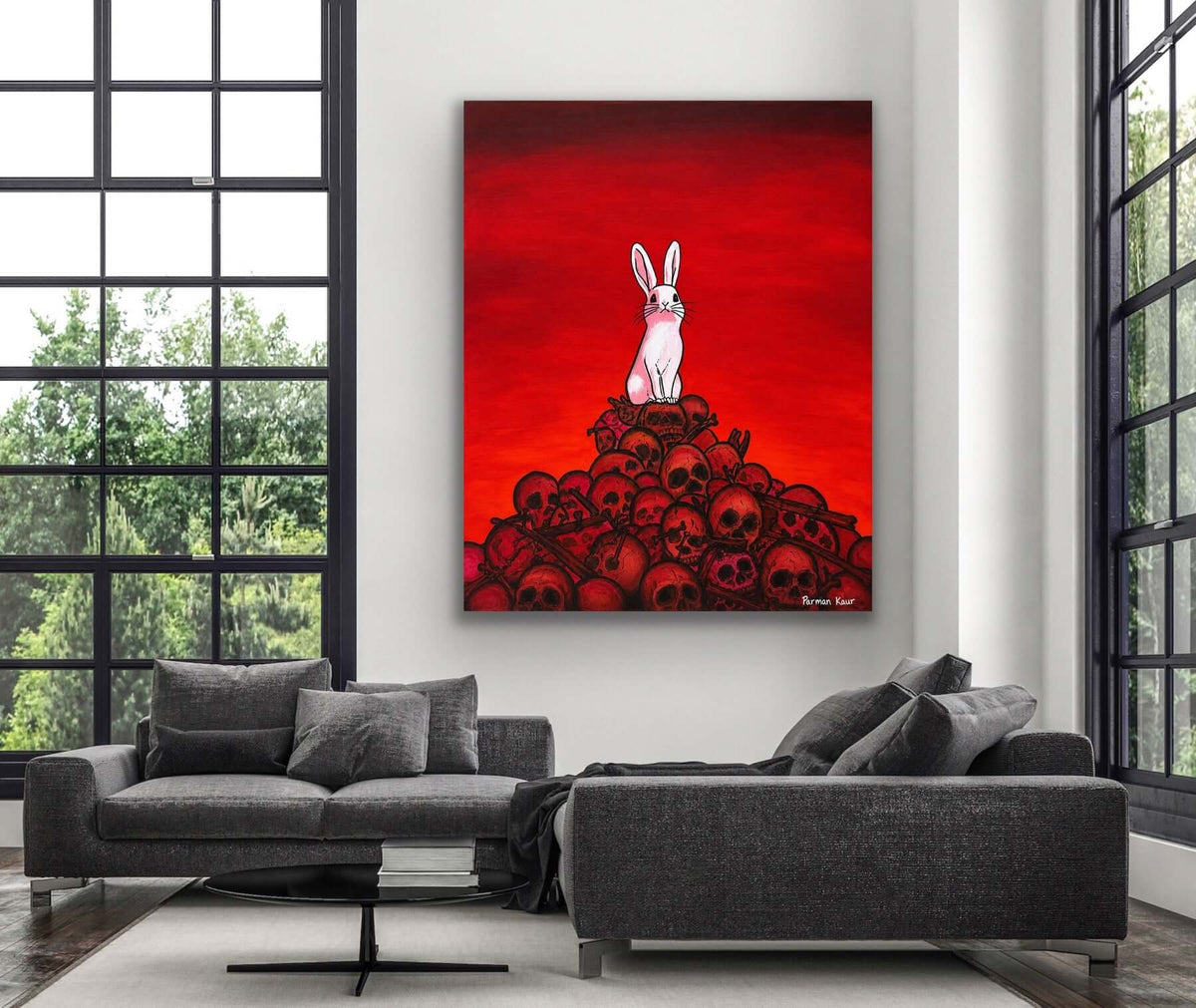 The Rabbit Among Skulls Art Print featuring a white rabbit on a pile of skulls with a dramatic red background.